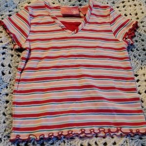 Pink, red, blue, and white striped shirt.